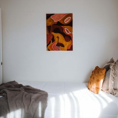 A quiet, empty yoga mat in a room with soft morning light.